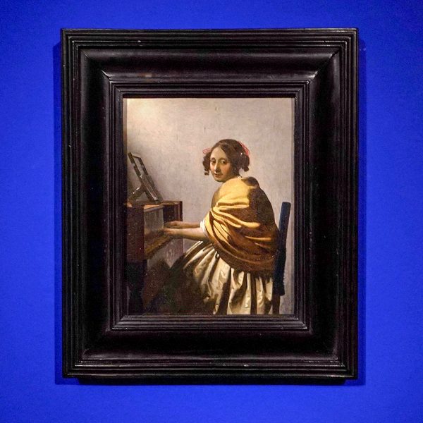 Johannes Vermeer - Jonge vrouw aan het virginaal - Olieverf op doek, circa 1670-1675