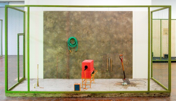 Gareth Moore - A Burning Bag as a Smoke-Grey Lotus (Compacted Earth, Concrete, Tempera, A Breathing Apparatus, A Garden Hose, Insect, A Horn, No one hears a Ditch Digger, Maxy, Mallet, A Drumming Noise) - Installatie