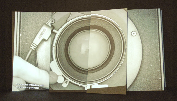 Hito Steyerl - Adorno's Grey - 14,20 minuten HDvideo en vier schuine schermen, plotprints op wand en foto's